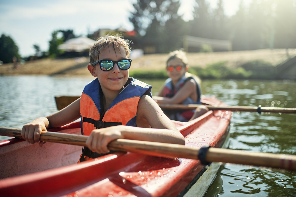 Two Young Campers in a Kayak