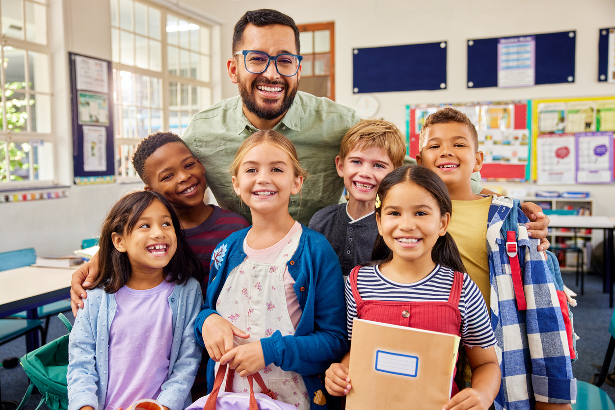 A Group of Students and Their Teacher Smile and Pose During Teacher Appreciation Week.