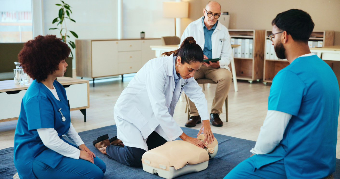 Nursing Students Learn Cpr Using a Manikin.