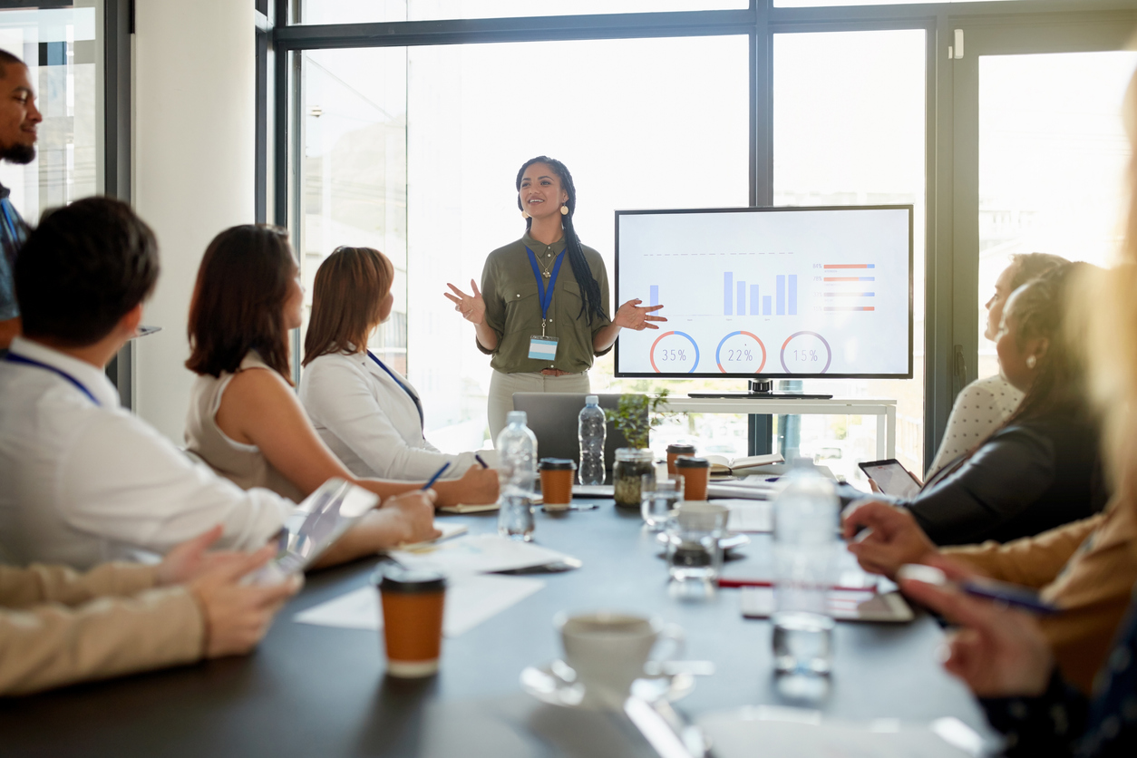 A Management Analyst Gives a Presentation to the Team.