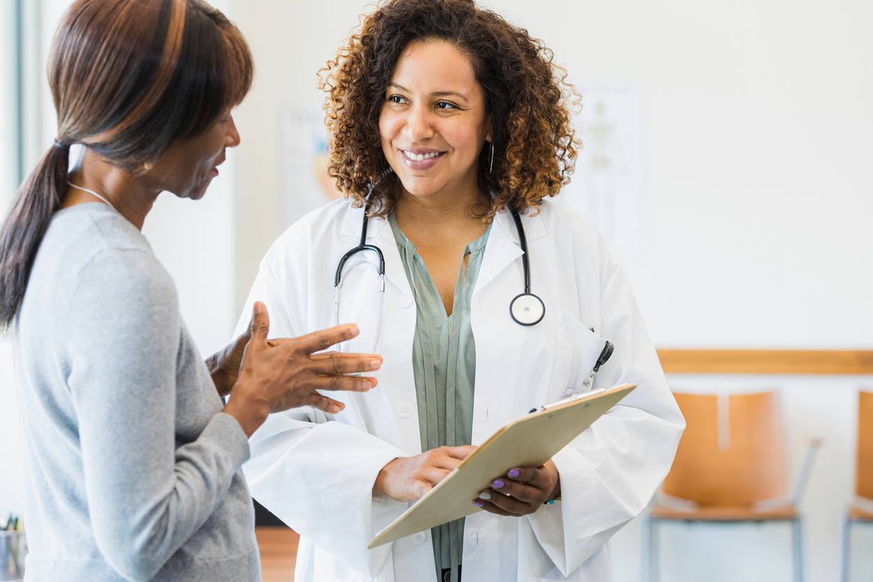 A Nurse Practitioner Speaks With a Patient in a Hospital Room..jpg