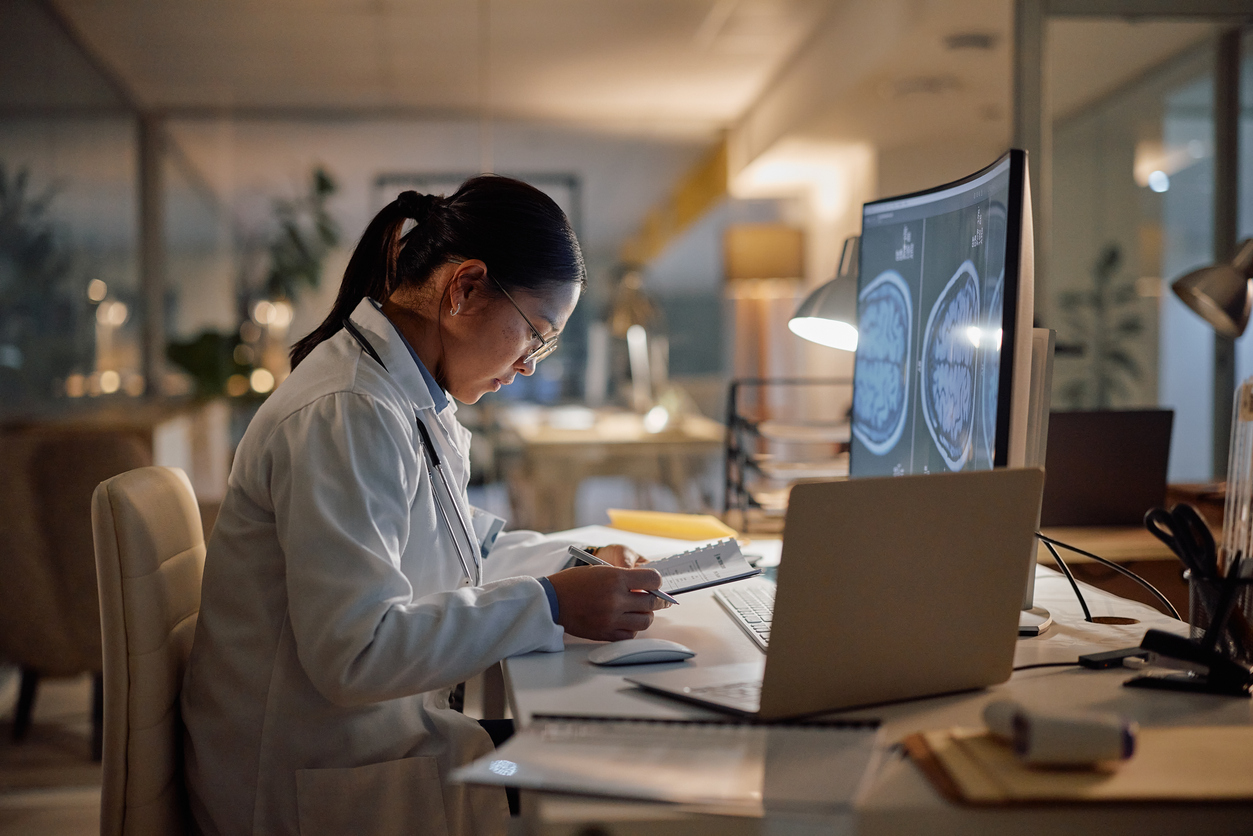 A Research Nurse Sits at a Desk and Conducts Research..jpg